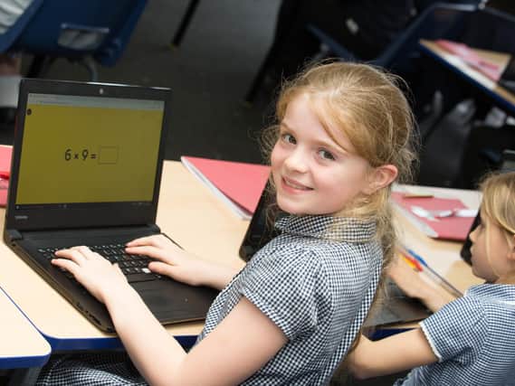 Schools laptop campaign - Harrogate pupil Lottie, ten, at Coppice Valley Primary School using her donated laptop.