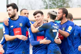 Harrogate Town players celebrate after Simon Power fired them into a 3-0 lead against Crawley in first-half stoppage-time. Pictures: UK Sports Images Ltd/Jamie Evans.