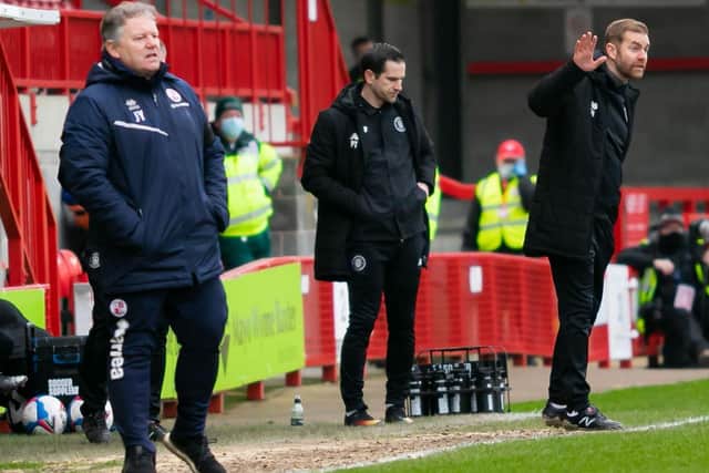 Crawley boss John Yems, left, and his opposite number, Simon Weaver, right, watch on from the sidelines. Picture: UK Sports Images Ltd/Jamie Evans.