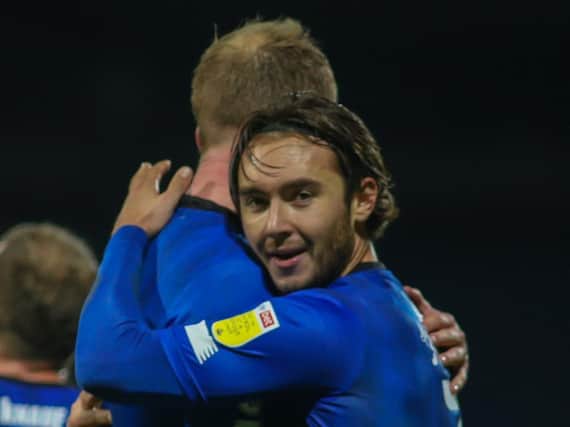 Dan Jones celebrates with team-mate Mark Beck following Harrogate Town's 1-0 win at Mansfield Town on November 24. The on-loan left-back has not played since. Pictures: Matt Kirkham