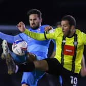 Harrogate Town striker Aaron Martin competes for the ball during Tuesday's League Two defeat to Cheltenham. Pictures: Matt Kirkham