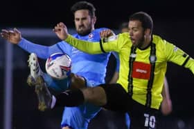 Harrogate Town striker Aaron Martin competes for the ball during Tuesday's League Two defeat to Cheltenham. Pictures: Matt Kirkham