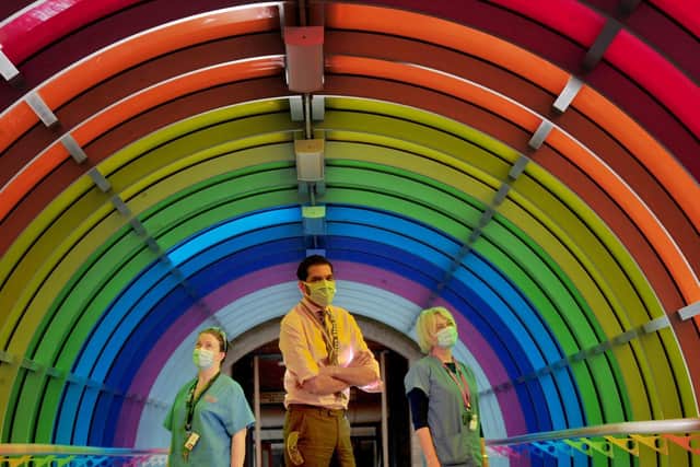 From left: Paula De Souza resusitation Lead, Steve Russell Chief Exec of Harrogate District Hospital and Sally Blackburn Mental Health Liason in the rainbow tunnel to celebrate diversity at the hospital.