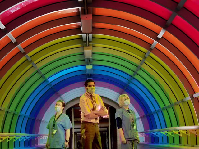 From left: Paula De Souza resusitation Lead, Steve Russell Chief Exec of Harrogate District Hospital and Sally Blackburn Mental Health Liason in the rainbow tunnel to celebrate diversity at the hospital.