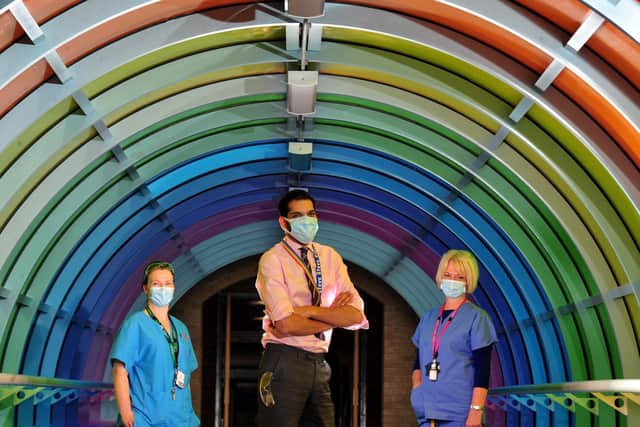 From left: Paula De Souza resusitation Lead, Steve Russell Chief Exec of Harrogate District Hospital and Sally Blackburn Mental Health Liason in the rainbow tunnel to celebrate diversity at the hospital