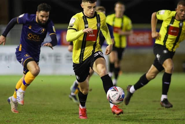 Simon Power runs at the Mansfield defence.