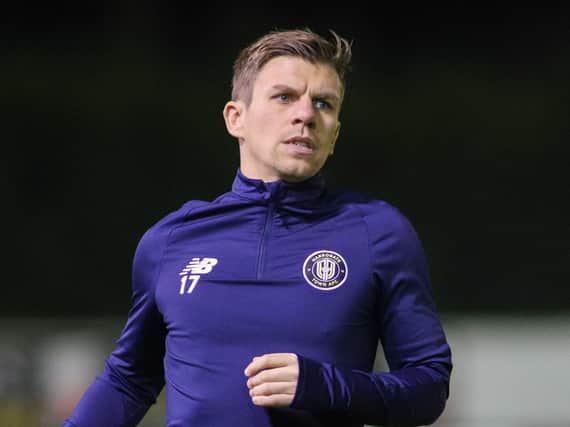 Harrogate Town midfielder Lloyd Kerry warms up at the EnviroVent Stadium. Pictures: Matt Kikrham