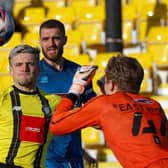 Josh March is beaten to the ball by Grimsby goalkeeper Jake Eastwood. Pictures: Matt Kirkham