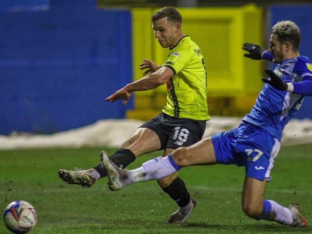 Jack Muldoon fires in Harrogate Town's late winner at Barrow. Pictures: Matt Kirkham