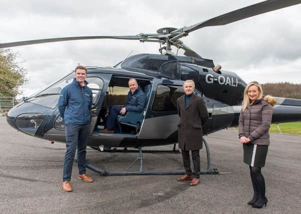 Jack Schofield and father Jason of The Helicopter Company, with James Towler and Emily Steed of McCormicks Solicitors, who advised on the acquisition. PHOTO: Kate Mallender.