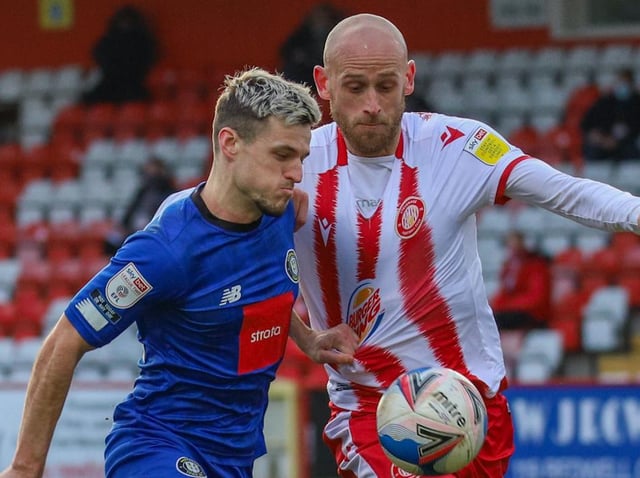 Harrogate Town striker Josh March looks for a route past Stevenage defender Scott Cuthbert. Pictures: Matt Kirkham