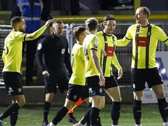 Mark Beck, right, celebrates with his Harrogate Town team-mates after netting a first-minute strike against Colchester United. Picture: Matt Kirkham