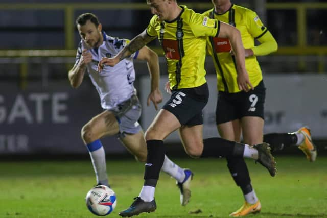 Will Smith races clean through on the Colchester United goal.