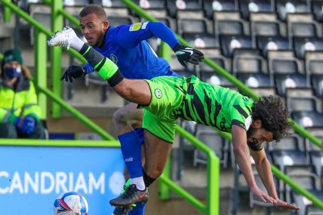Substitute Aaron Martin competes for the ball.