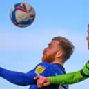 George Thomson challenges for a header during Harrogate Town's defeat at Forest Green Rovers. Pictures: Matt Kirkham