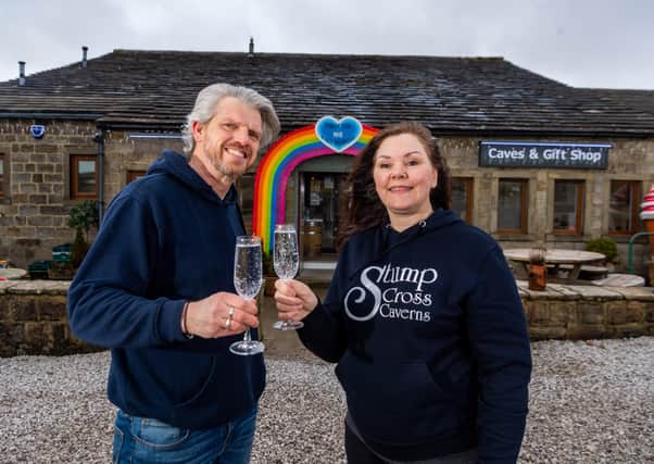 Lisa Bowerman, owner of Stumps Cross Caverns, with her partner Nick Markham, celebrating the news of reaching the fundraising target to keep the Pateley Bridge attraction open. Picture James Hardisty.