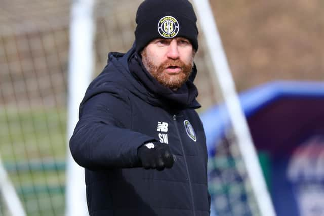 Sulphurites chief Simon Weaver points the way during a Harrogate Town training session.