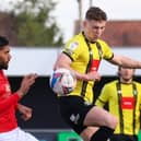 Harrogate Town's Josh McPake beats Morecambe defender Kelvin Mellor to the ball during Saturday's League Two clash at the EnviroVent Stadium. Picture: Matt Kirkham