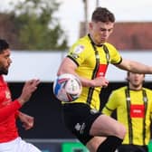 Harrogate Town's Josh McPake beats Morecambe defender Kelvin Mellor to the ball during Saturday's League Two clash at the EnviroVent Stadium. Picture: Matt Kirkham