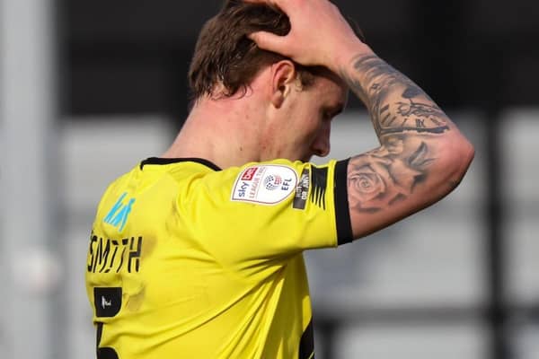 Harrogate Town centre-half Will Smith holds his head in his hands during Saturday's 1-0 home defeat to Morecambe. Pictures: Matt Kirkham
