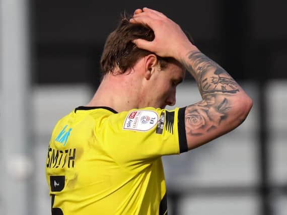 Harrogate Town centre-half Will Smith holds his head in his hands during Saturday's 1-0 home defeat to Morecambe. Pictures: Matt Kirkham