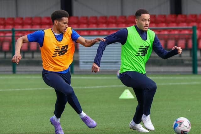 On-loan Norwich City midfielder Wesley Hondermarck, left, chases down Town utility man Jay Williams during a training session.