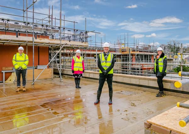 Celebrating the topping out of Springfield's luxury new care home in Harrogate are (l to r) Neil Silcock (Simpson), Sally Rasmussen (Springfield Healthcare), Graeme Lee (Springfield Healthcare) and Jo Hawkins-Spencer (Projex Building.