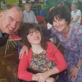 Henshaws' champion fundraising student Flora Nelson with her parents, David and Sally.