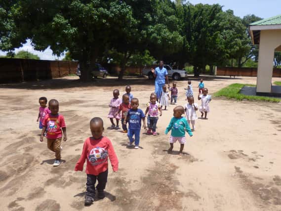 Children in Africa being supported by Harrogate-based charity Open Arms Malawi.