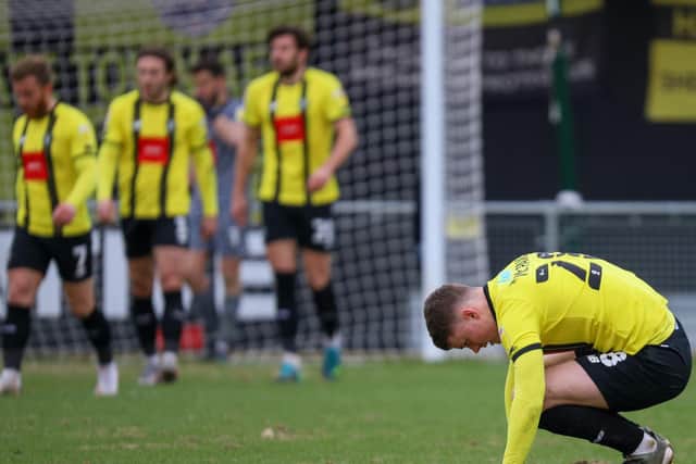 Harrogate Town players react to falling behind against the Shrimpers.