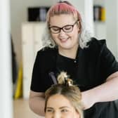 Free offer - A hairdressing student at work in Harrogate College.