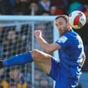 Rory McArdle heads clear during Harrogate Town's FA Cup third round defeat at Luton Town. Picture: Matt Kirkham