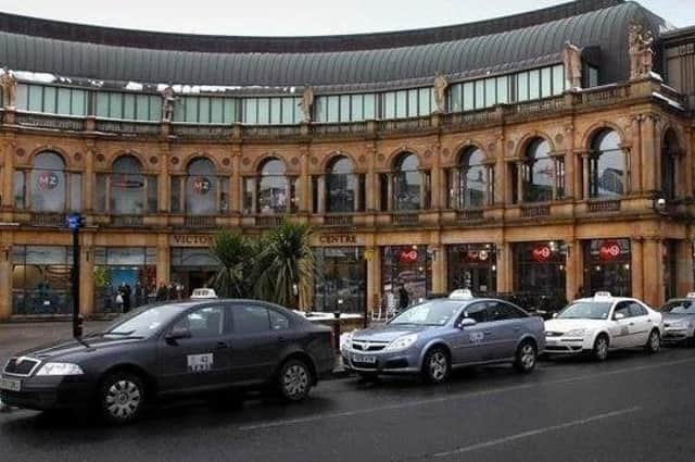 Taxis on the rank outside Victoria Shopping Centre in Harrogate town centre.