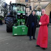 Rev'd Canon Leslie Newton, the Very Rev'd John Dobson, Dean of Ripon, and Lord Lft of North Yorkshire Johanna Ropner with the tractors outside Ripon Cathedral