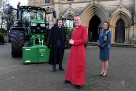 Rev'd Canon Leslie Newton, the Very Rev'd John Dobson, Dean of Ripon, and Lord Lft of North Yorkshire Johanna Ropner with the tractors outside Ripon Cathedral