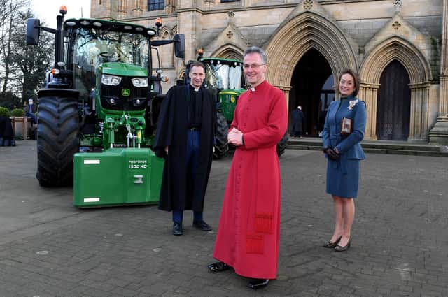 Rev'd Canon Leslie Newton, the Very Rev'd John Dobson, Dean of Ripon, and Lord Lft of North Yorkshire Johanna Ropner with the tractors outside Ripon Cathedral
