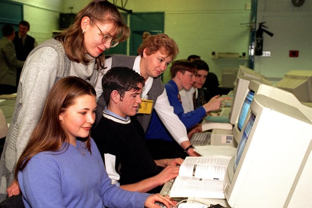 12 Russian teachers visited Garforth Community College in November 1997. Pictured in the economics and business department are Elena Axenova (left) and Maia Katsnelson watching sixth formers Vanessa Yoward and Stephen Hall at work.