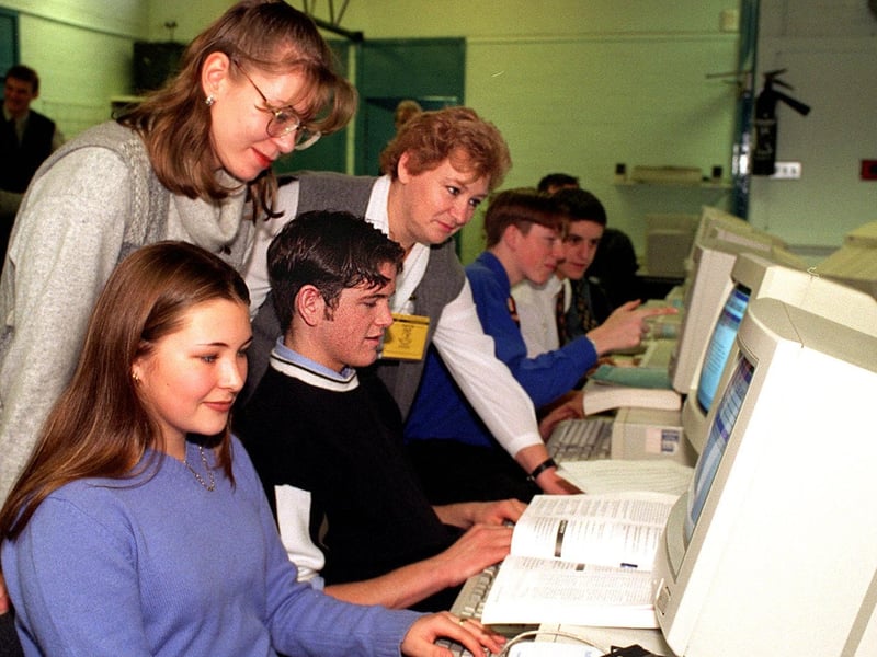 12 Russian teachers visited Garforth Community College in November 1997. Pictured in the economics and business department are Elena Axenova (left) and Maia Katsnelson watching sixth formers Vanessa Yoward and Stephen Hall at work.