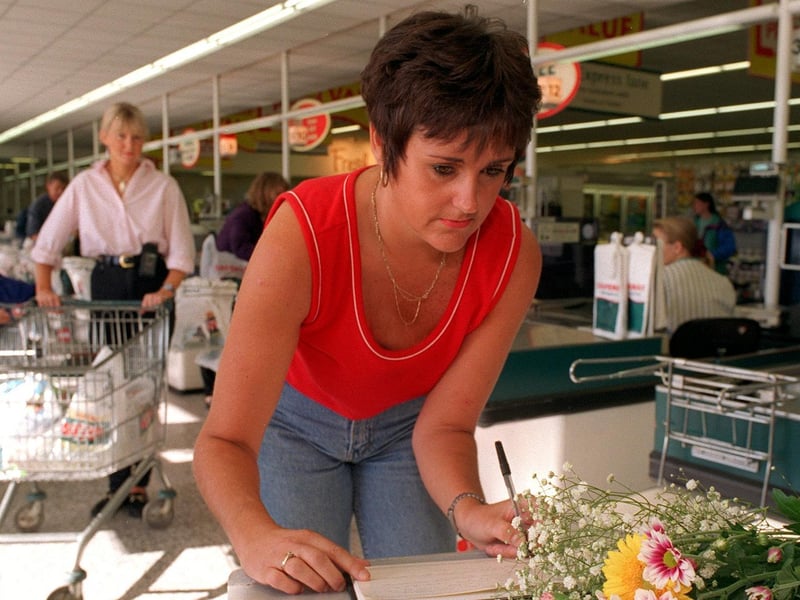Jackie Allsop signs a book of condolence for Diana, Princess of Wales at Safeway's in Garforth in September 1997.