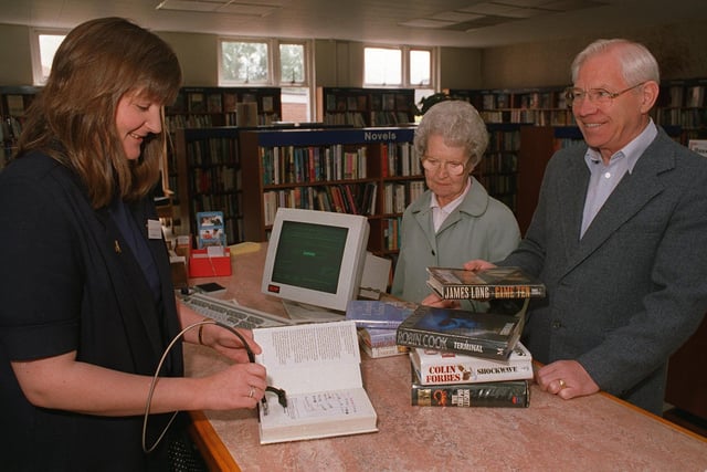New computer systems arrived at Garforth Library in June 1996. Pictured is chief librarian Jan Cryer with library users Mr and Mrs Smith.