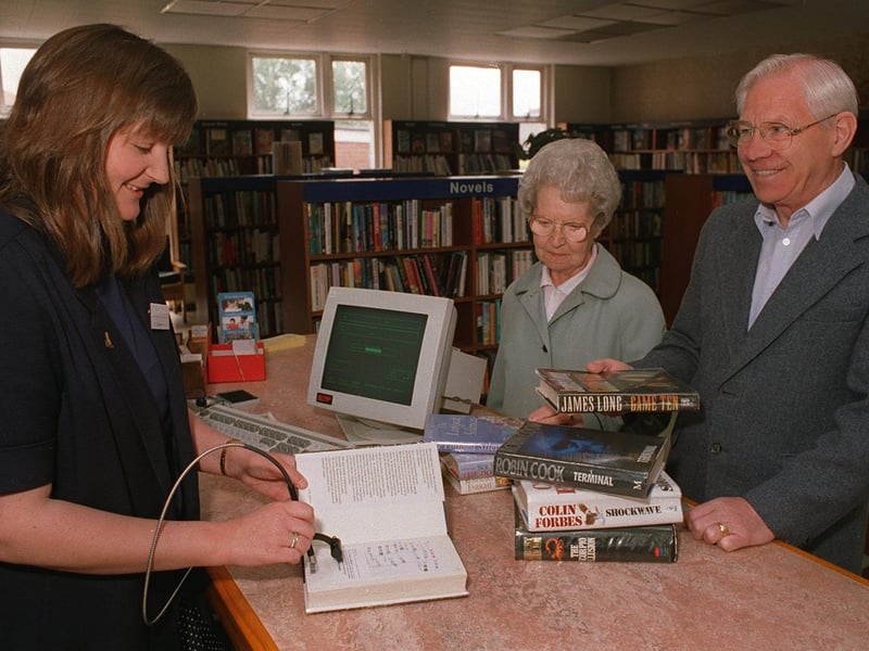 New computer systems arrived at Garforth Library in June 1996. Pictured is chief librarian Jan Cryer with library users Mr and Mrs Smith.