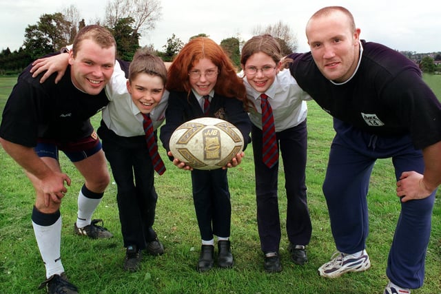 Castleford Tigers stars Ian Tonks (left) and Nathan Sykes visited Garforth Community College to  give rugby coaching masterclass. They are pictured with pupils, from left, Robert Scott, Zoe Sharp and Danielle Scales.