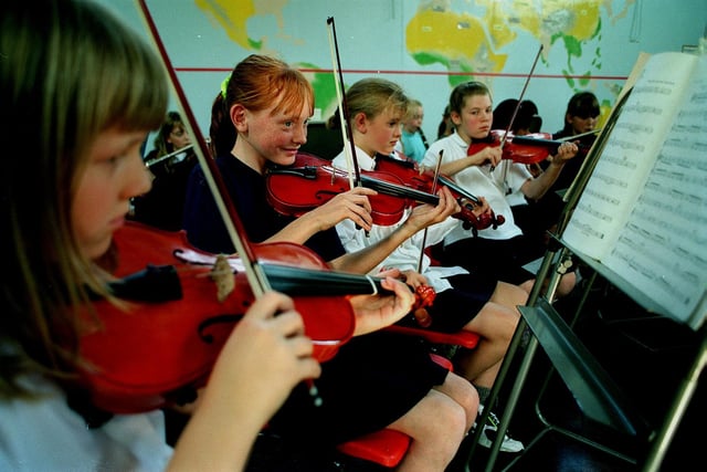 September `997 and pictured are four members of the orchestra at Ninelands Lane Primary School. From left are Kirsty Winter, Lisa Llewellyn, Laura Pritchard and Eleanor Leatham.