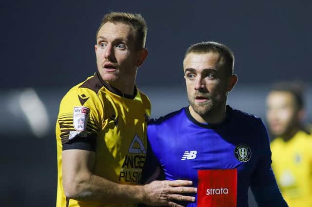 Alex Pattison, pictured in action during December's League Two clash between Sutton United and Harrogate Town, could return from injury when the Sulphurites return to South London in the EFL Trophy quarter-finals. Pictures: Matt Kirkham