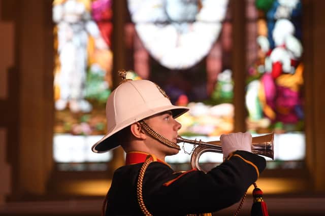 The Royal Marines bugler plays the Last Post at the end of the committal of D-Day hero John Rushton at Stonefall Crematorium in Harrogate. (Picture Gerard Binks)