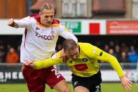 Harrogate Town's on-loan Sunderland winger Jack Diamond looks to escape the attentions of Bradford City right-back Oscar Threlkeld. Pictures: Matt Kirkham