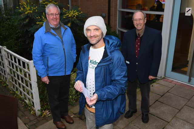 Mark Smith presented a cheque for £481.00 to Dr Albert Day and John Fox, Friends of Harrogate Hospital, following his 850-mile walking challenge