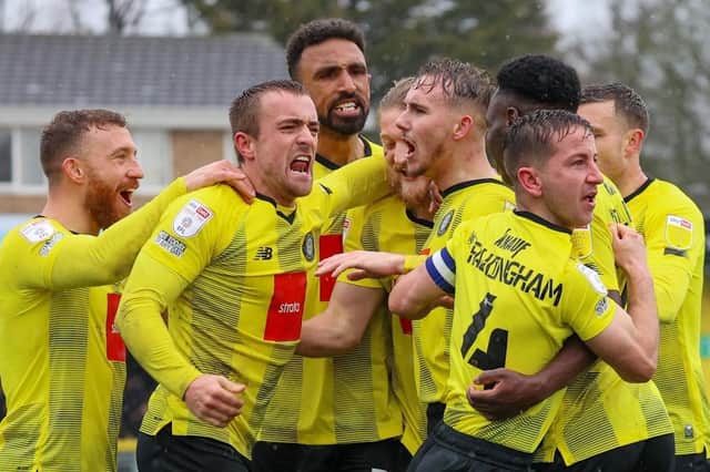 Harrogate Town's players celebrate taking a 2-0 lead against Bradford City on Saturday afternoon. Pictures: Matt Kirkham