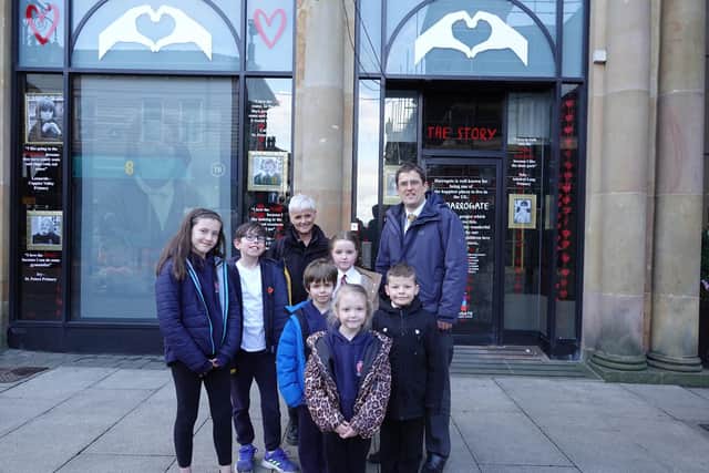 Picture outside Victoria Shopping Centre are Harrogate BID host Jo Caswell, St Peter’s Primary School Head Paul Griffiths and pupils from St Peter’s who are starring in the I Love Harrogate video.