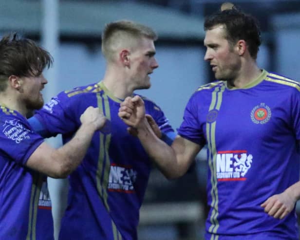 Rhys Davies, left, is congratulated by Marcus Day and Rob Youhill after netting a late goal to put Harrogate Railway 3-0 up against Clipstone. Picture: Craig Dinsdale